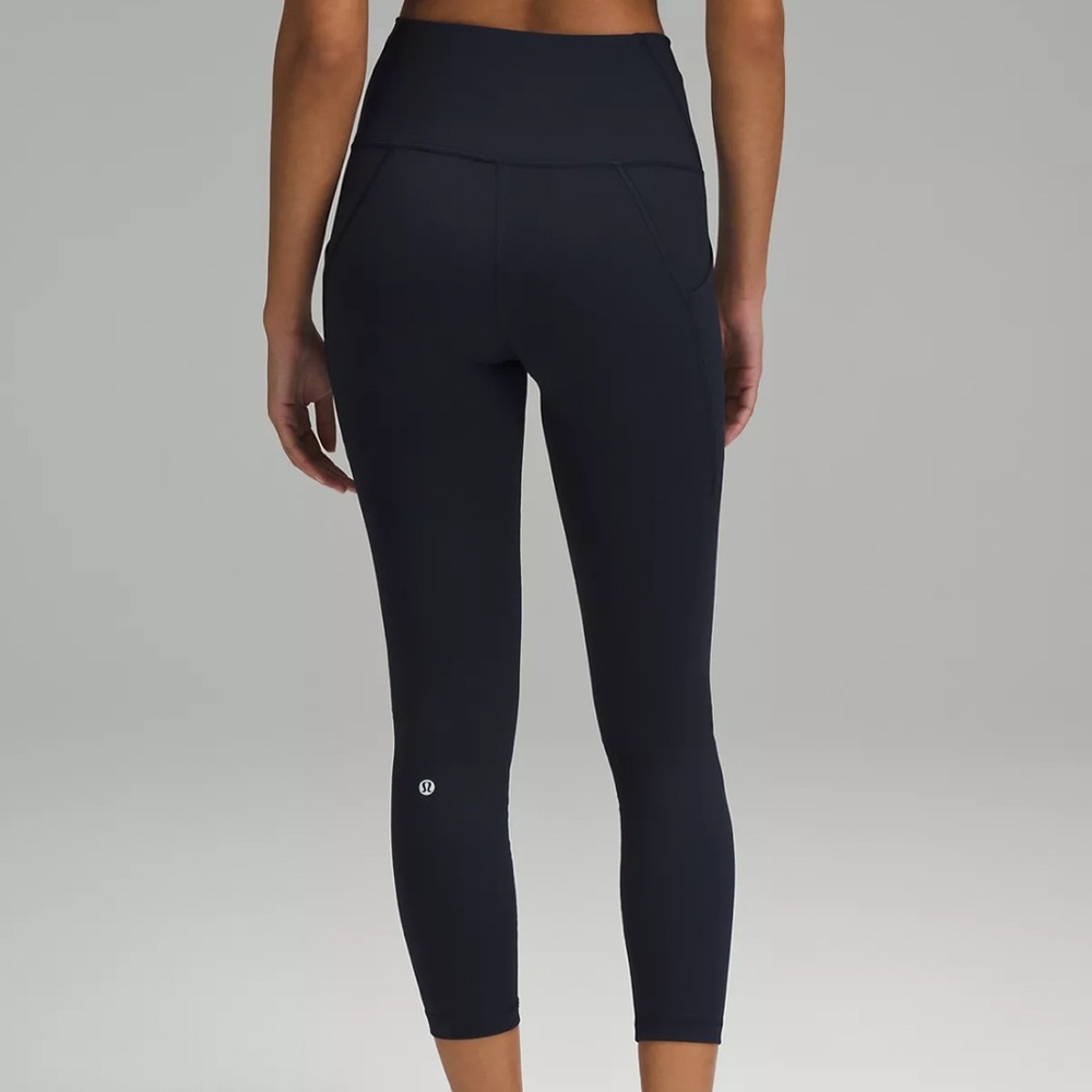 Wunder Train High-Rise Tight with Pockets 25", color: navy,  size 4